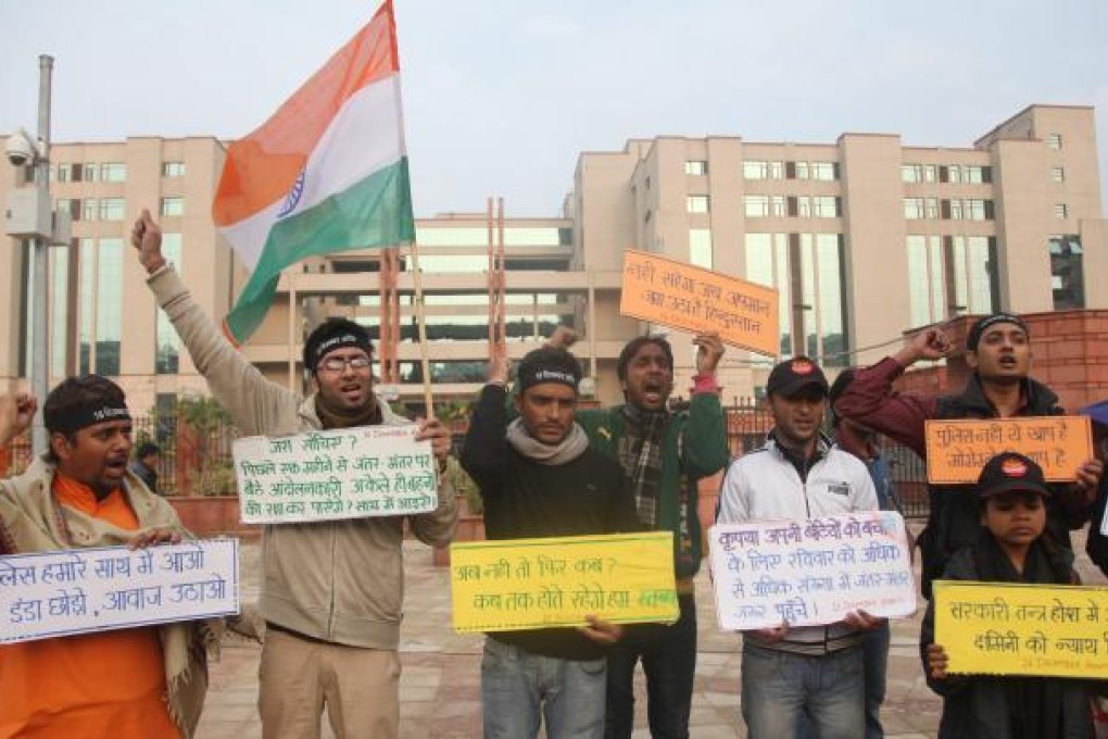 Indian activists protest outside the Delhi Saket court complex where the five accused of the brutal Delhi gang-rape and murder are facing trials. Photo: EPA