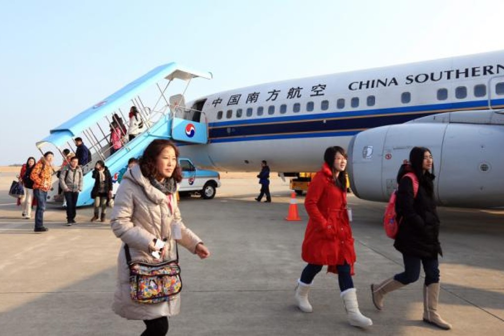 A record number of Chinese consumers are expected to spend their Lunar New Year holidays travelling overseas this year. Photo: EPA