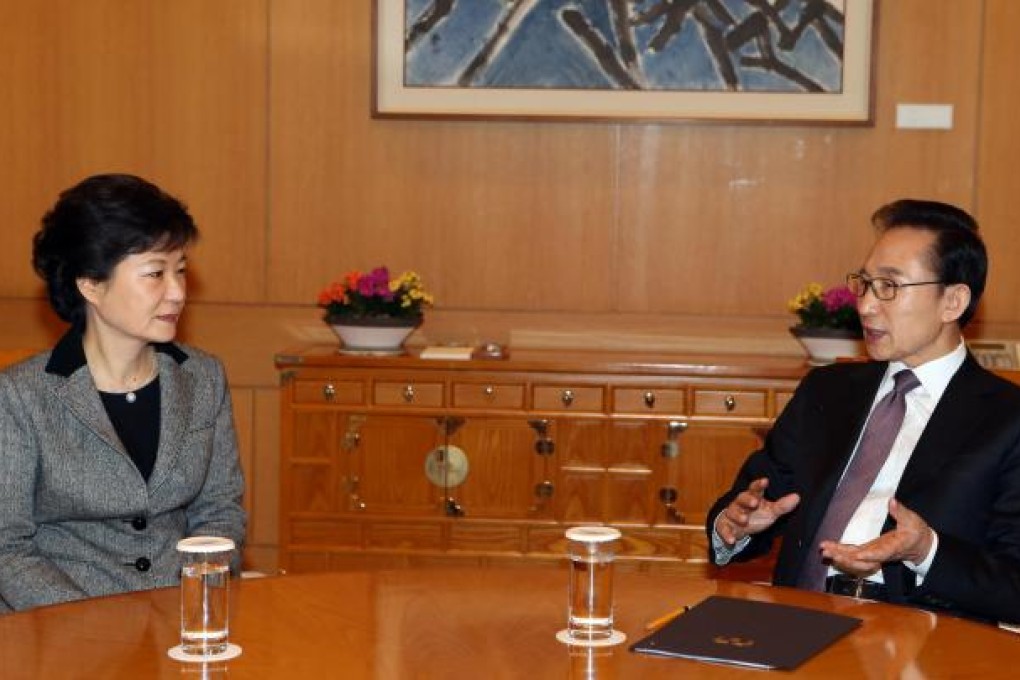 South Korean President Lee Myung-bak (right) talks with Park Geun-hye (left) on Tuesday, after North Korea's nuclear test. Photo: AP