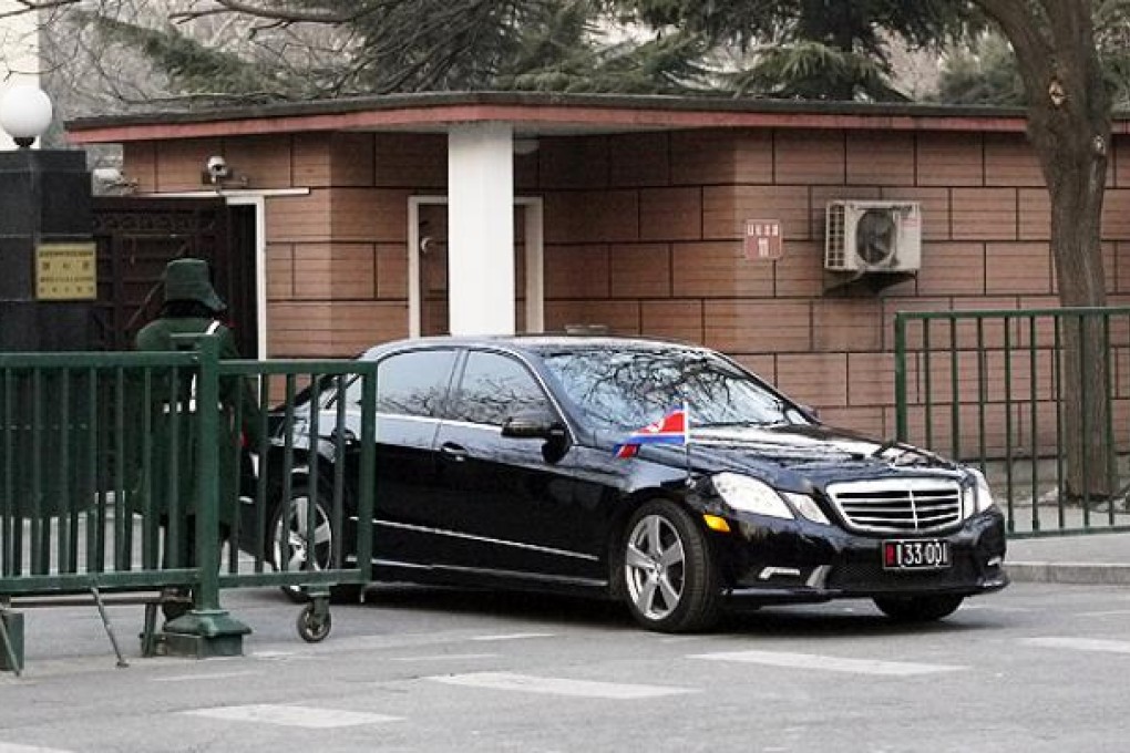 The car of the North Korean ambassador to China emerges from the North Korean embassy in Beijing. Photo: AP