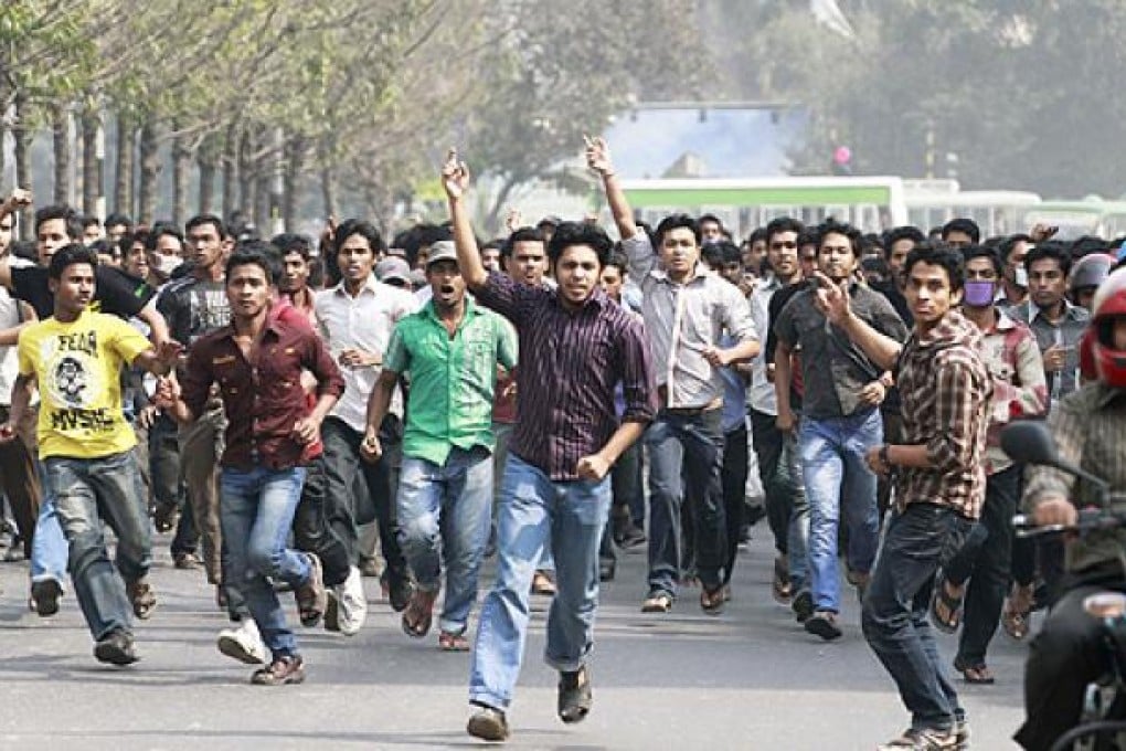 Jammat-e-Islami activists shout slogans during a rally in Dhaka on Tuesday. Photo: Reuters