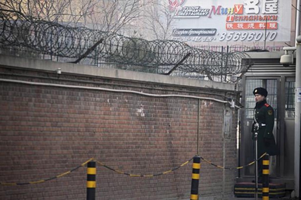 A paramilitary policeman guards the North Korean embassy in Beijing. Photo: Reuters