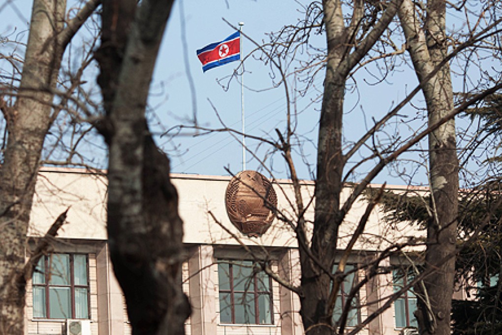 A North Korean flag flies above the North Korean embassy in Beijing. North Korea's third nuclear test is expected to push Beijing into getting tougher with its wayward neighbour. Photo: AFP