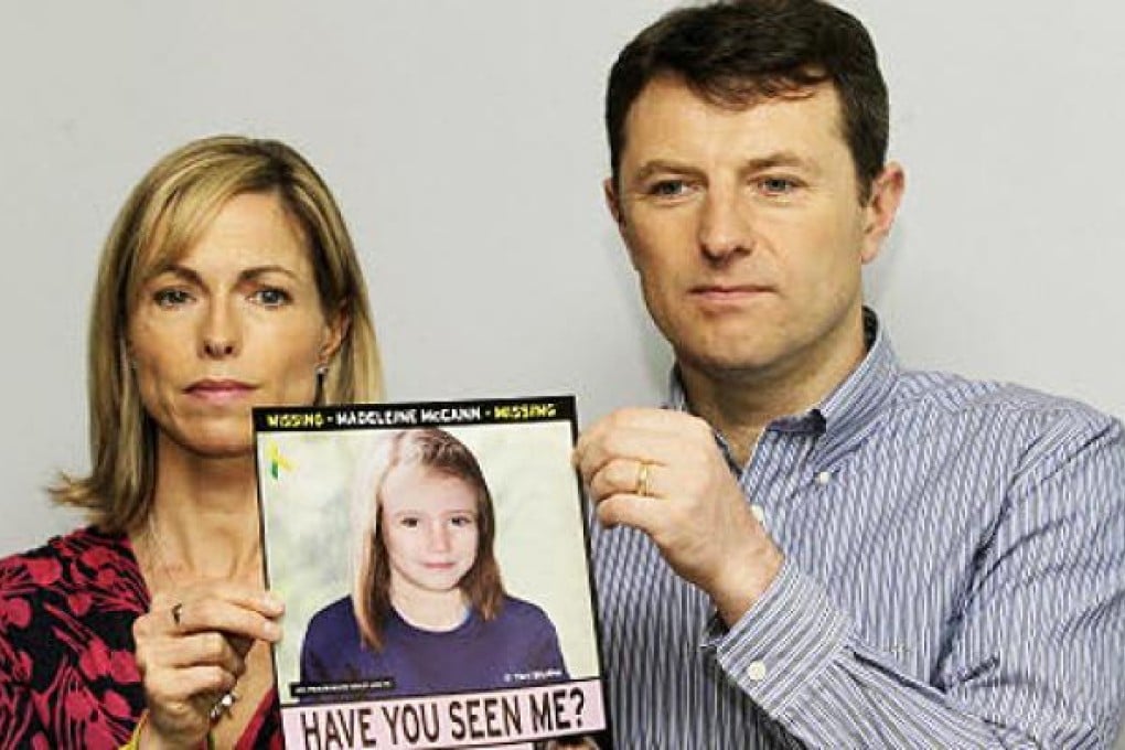 Kate and Gerry McCann pose with a missing poster, an age progression computer generated image of their daughter, Madeleine. Photo: AP