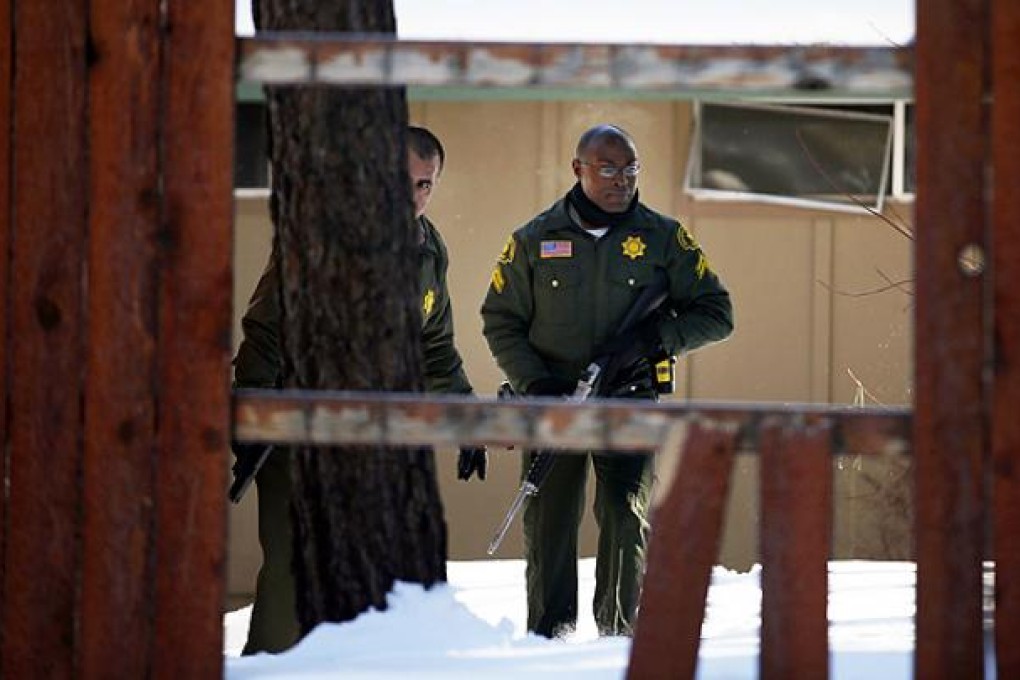 San Bernardino County Sheriff officers continue their hunt for fugitive former policeman Christopher Dorner in Big Bear Lake, California. Photo: AP