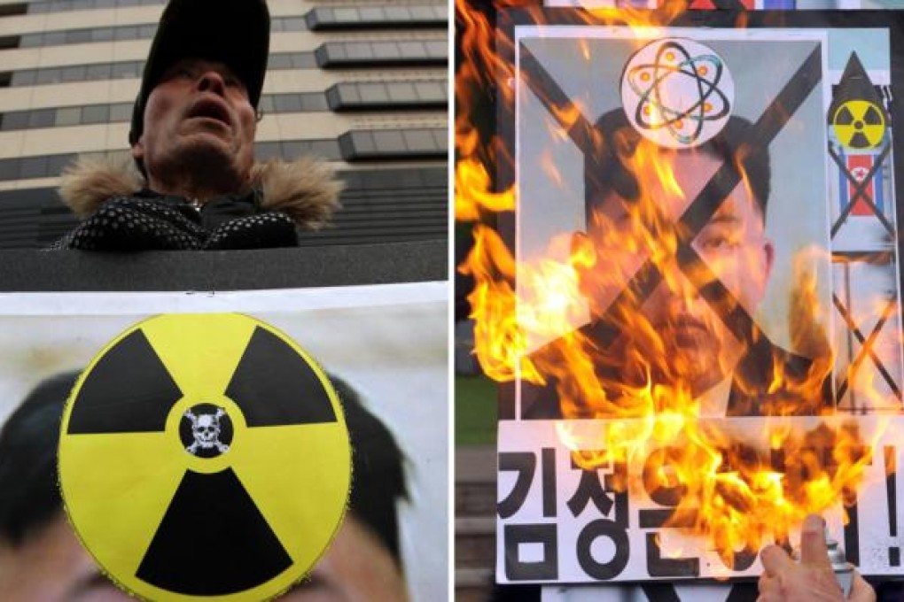 Activists from an anti-North Korea civic group join a rally to condemn yesterday's nuclear blast. Photos: Xinhua, AFP