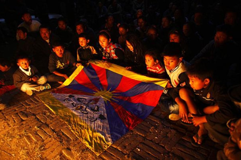 Young exile Tibetans participate in a candlelight vigil in Katmandu, Nepal. Photo: AP