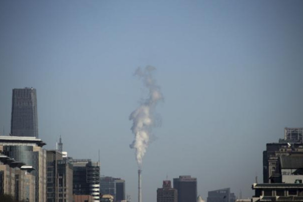 Steam billows from a chimney of a heating plant near the World Trade Centre Tower III in central Beijing. Photo: Reuters