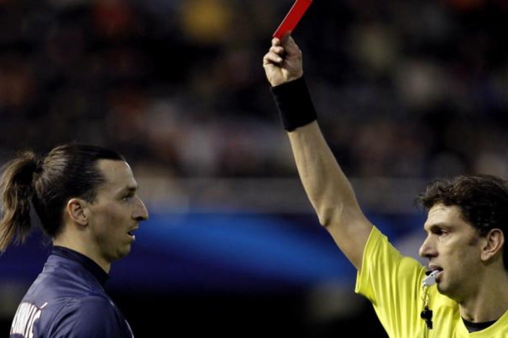 Zlatan Ibrahimovic receives a red card for an aggressive tackle during PSG's Champions League victory in Valencia. Photo: EPA