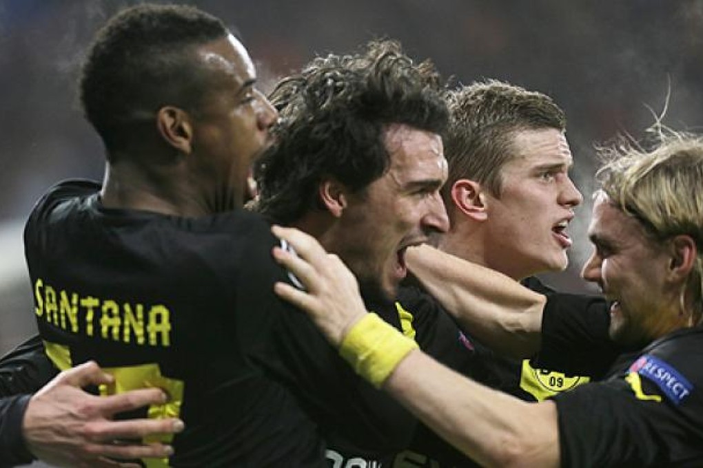 Players of Borussia Dortmund celebrate after scoring against Shakhtar Donetsk. Photo: AP
