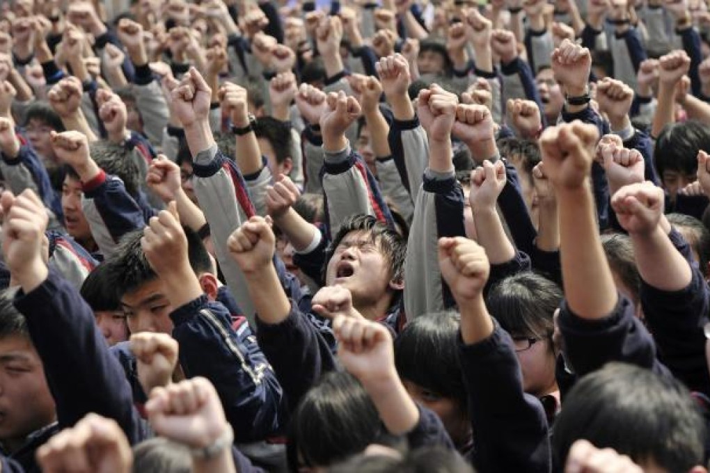 Mainland students chant, "I must go to college" and "Father and mother, I love you" - sentiments that reflect the immense pressure they face from school and their parents. Photo: Reuters