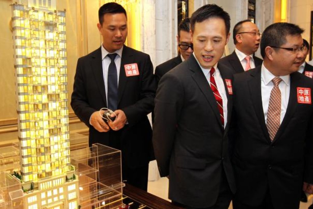 Victor Tin (2nd from left), associate director of Sino Land says the firm will offer an initial batch of 30 flats at The Avery in the first stage. Photo: Dickson Lee