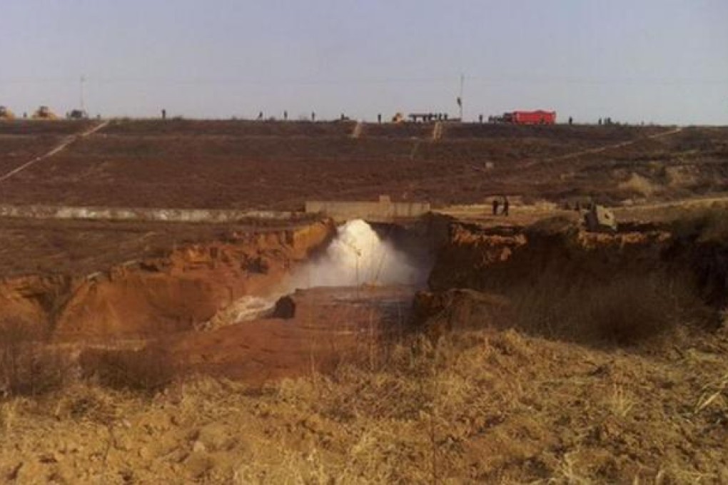 The breached dam at the Quting reservoir. Photo: SCMP