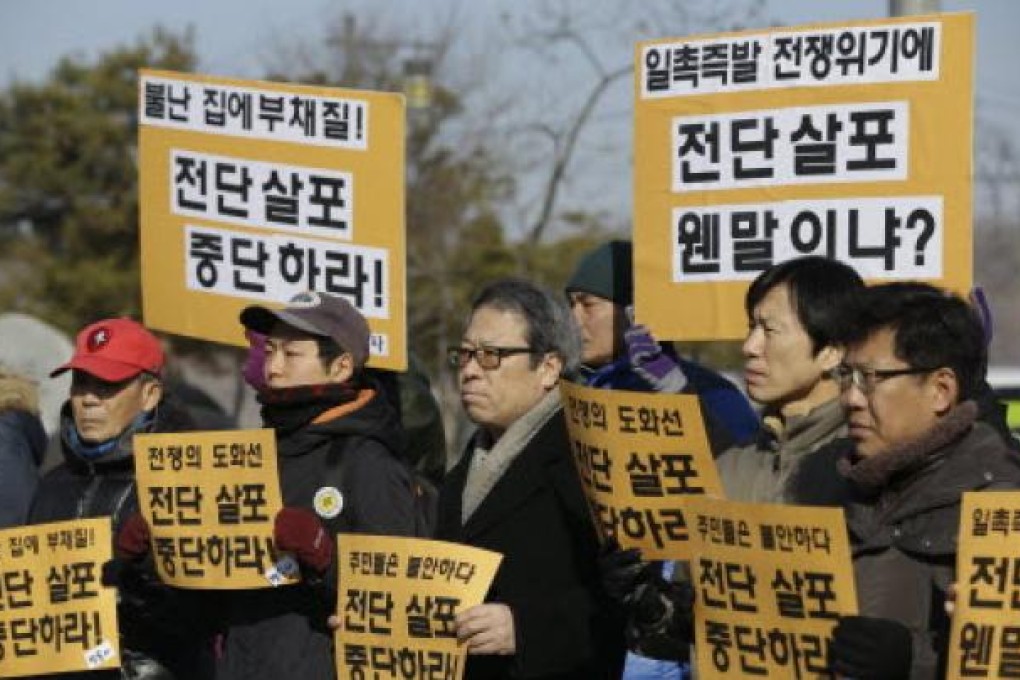 South Korean peace activists denounce North Korea's nuclear tests in Paju, north of Seoul, South Korea on Saturday. Photo: AP