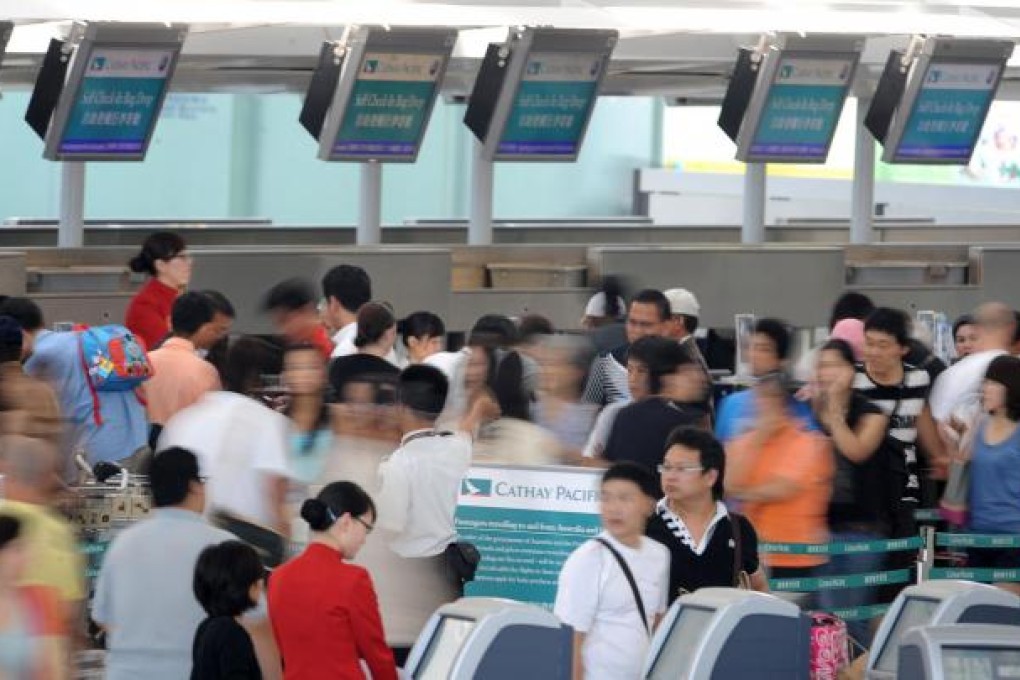 Cathay Pacific Airways is trying to ward off competition from budget carriers with a "fanfares" programme of discount tickets. Photo: AFP