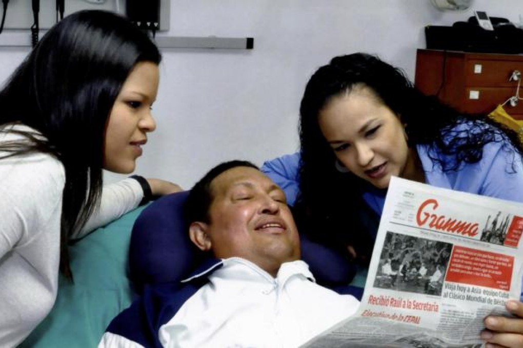 A handout photo shows Venezuela President Hugo Chavez with his daughters, Maria Gabriela (left) and Rosa Virginia. Photo: NYT