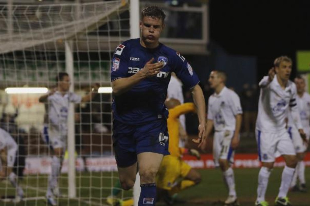 Oldham's Matt Smith celebrates his equaliser. Photo: Reuters