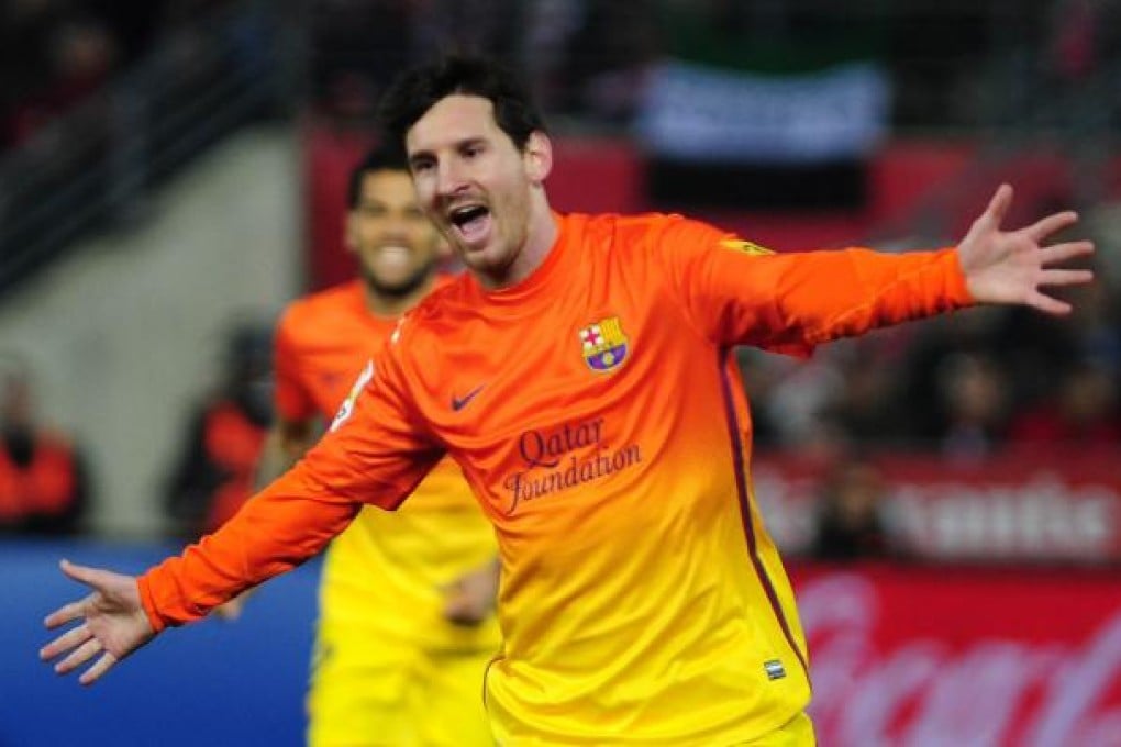 Lionel Messi celebrates after scoring against Granada on Saturday. Photo: AFP