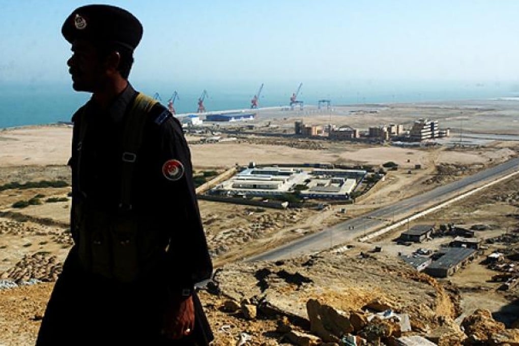 A Pakistani soldier stands in front of the Gwadar port, which is potentially a vital link to China's oil and gas supply chain. Photo: AP