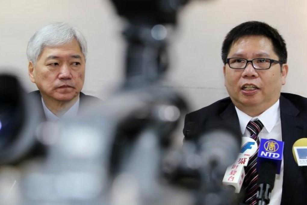 Travel Industry Council executive director Joseph Tung Yao-chung (left) and chairman Michael Wu Siu-ieng meet the media about a group of mainland travellers spend their night in the city on a coach. Photo: Edmond So