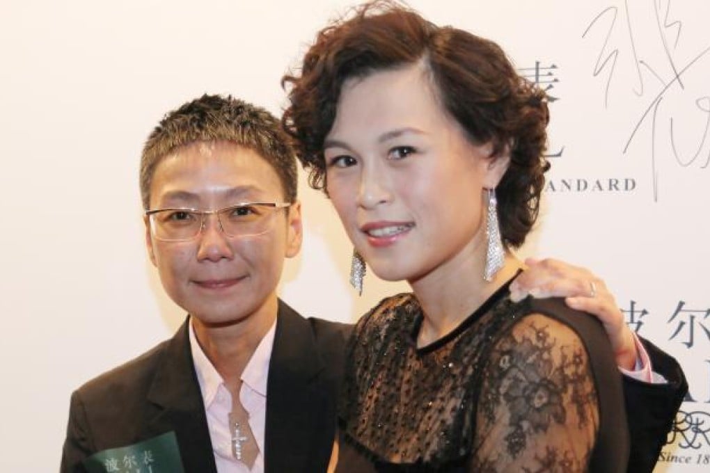Gigi Chao, right, daughter of the Hong Kong property tycoon Cecil Chao, poses with her partner Sean Eav at an event in Hong Kong. Photo: AP