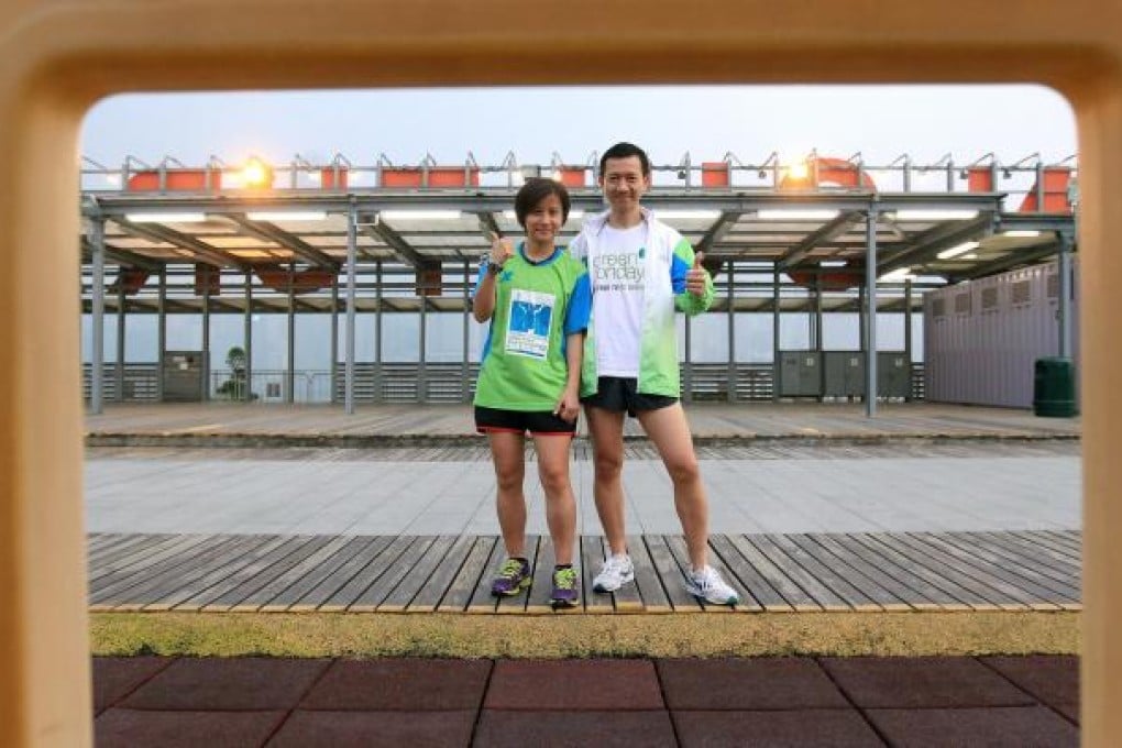 Marathon runners Martha Ng (left) and Francis Ngai at West Kowloon Waterfront Promenade. Photo: Jonathan Wong