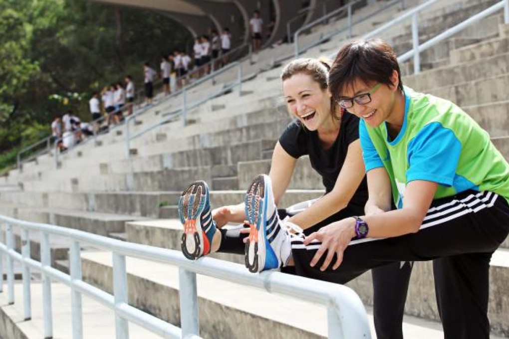 Rachel Jacqueline (black top) trains with top local female marathon runner, Alison Chow. Photo: Nora Tam