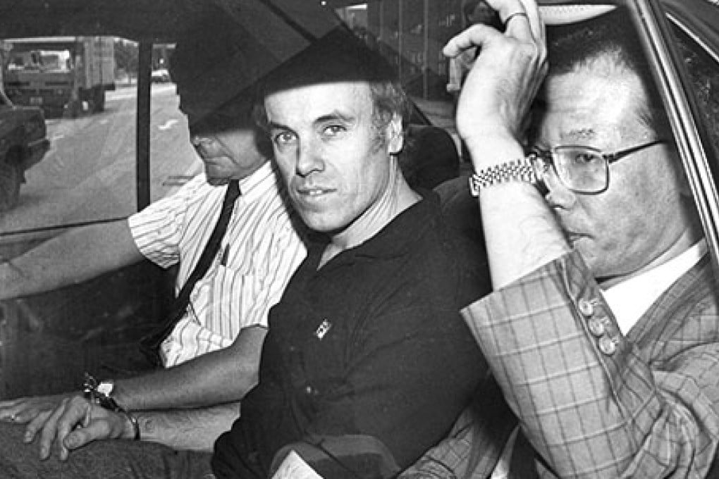 THEN: Top prosecutor Warwick Reid (centre) leaves Wan Chai court on June 20, 1990. Photo: SCMP Pictures