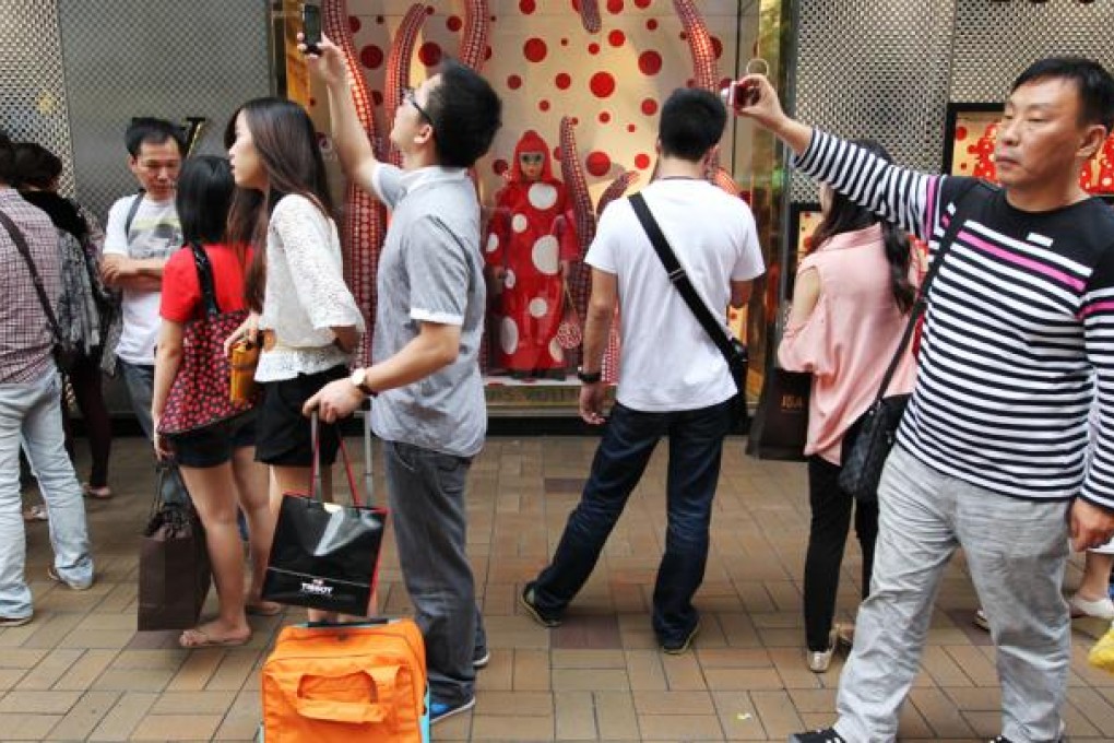 Mainland visitors shop at luxury retailers in Tsim Sha Tsui. Photo: Nora Tam