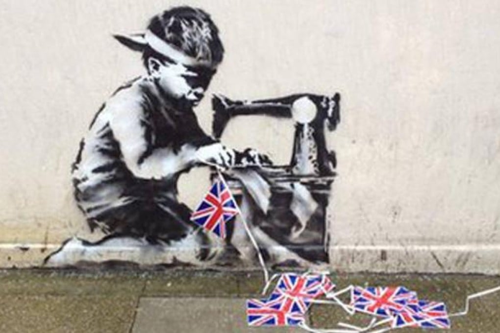 Banksy Slave Labour (Bunting Boy). London 2012 was removed from the wall of a discount store in Wood Green, north London. Photo: BBC