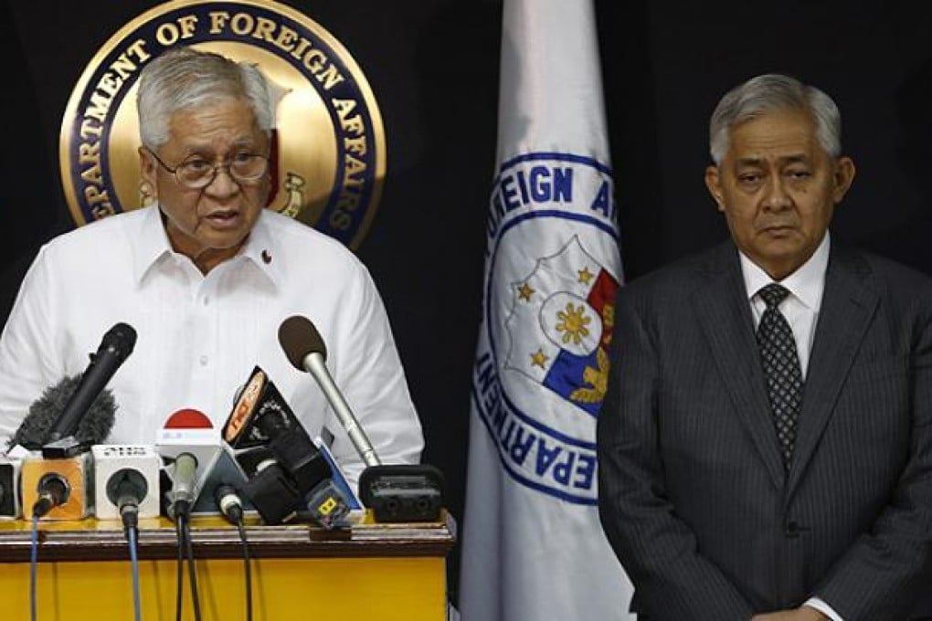 Philippines Foreign Affairs Secretary Albert Del Rosario (left) delivers a statement on territorial disputes in the South China Sea. Photo: EPA