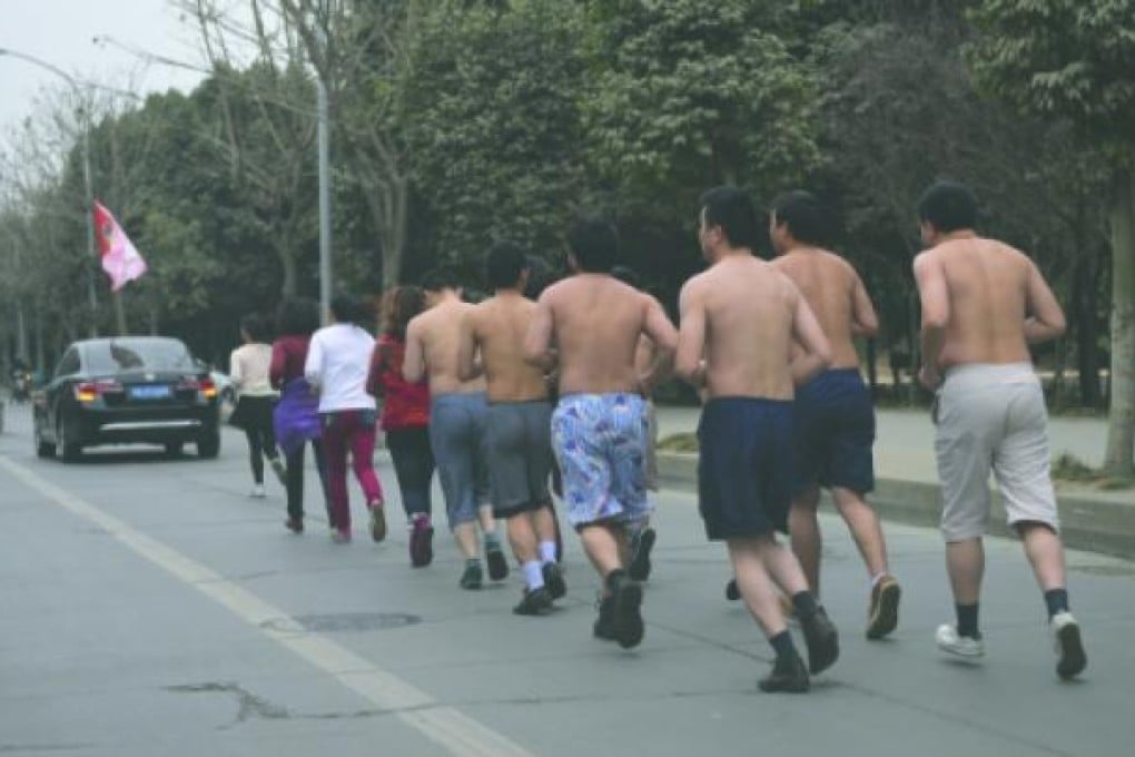 Employees are seen running on a road in Chengdu, Sichuan province. Photo: SCMP Pictures