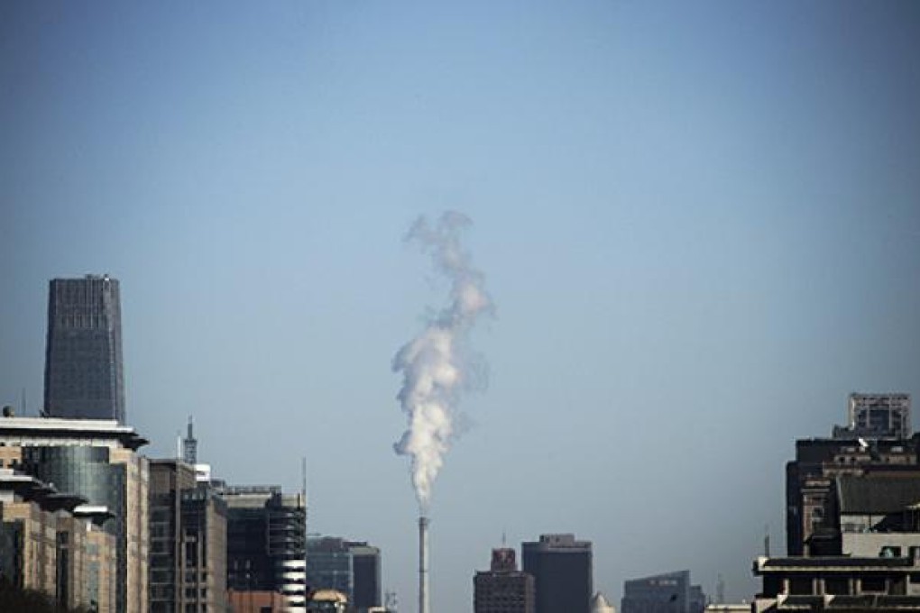 Steam comes out of a heating plant in Beijing. Photo: Reuters