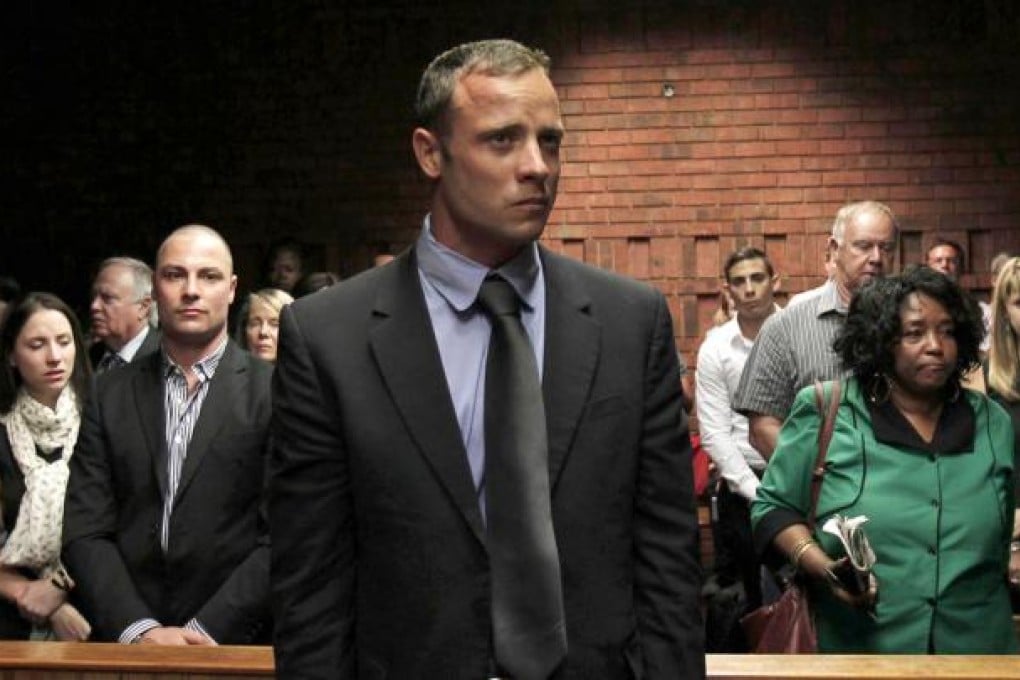 Oscar Pistorius awaits the start of proceedings yesterday at a court in Pretoria where he is seeking bail. Photo: Reuters