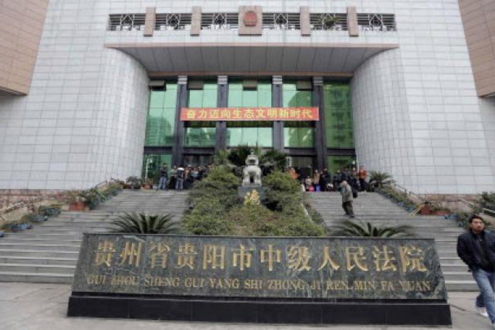 A man leaves the Guiyang Intermediate People's Court in Guizhou province. Photo: Reuters