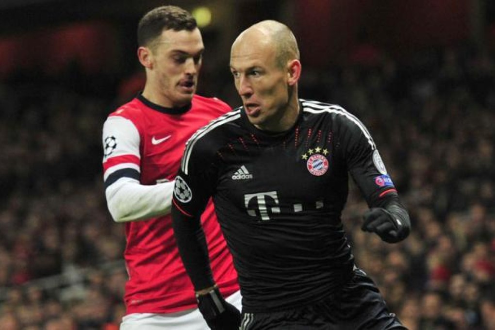 Arsenal defender Thomas Vermaelen challenges Bayern Munich midfielder Arjen Robben in their clash at the Emirates. Photo: AFP