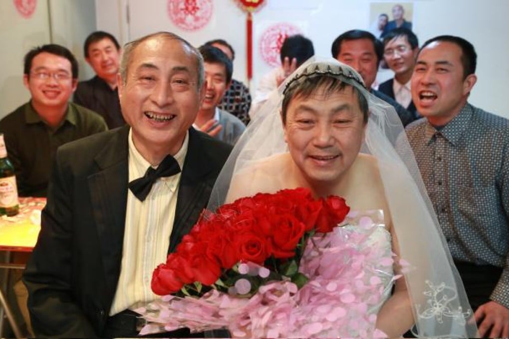 An elderly gay couple hold a wedding ceremony at a restaurant in Beijing on Jan 30, 2013. Photo: China Foto Press
