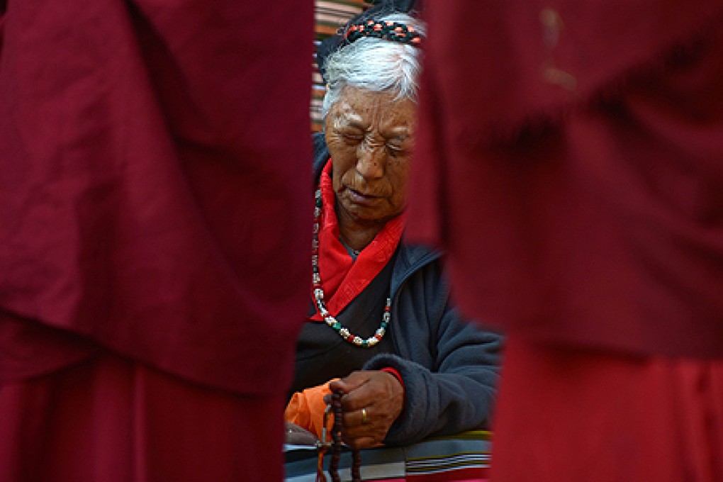 A Tibetan in exile observes the third day of Losar, the Tibetan new year, in Kathmandu last week. Photo: AFP
