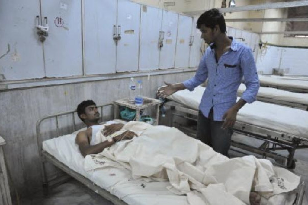 A bomb blast victim is treated at Osmania Hospital in Hyderabad. Twin bombings killed at least 20 people on Thursday. Photo: AFP