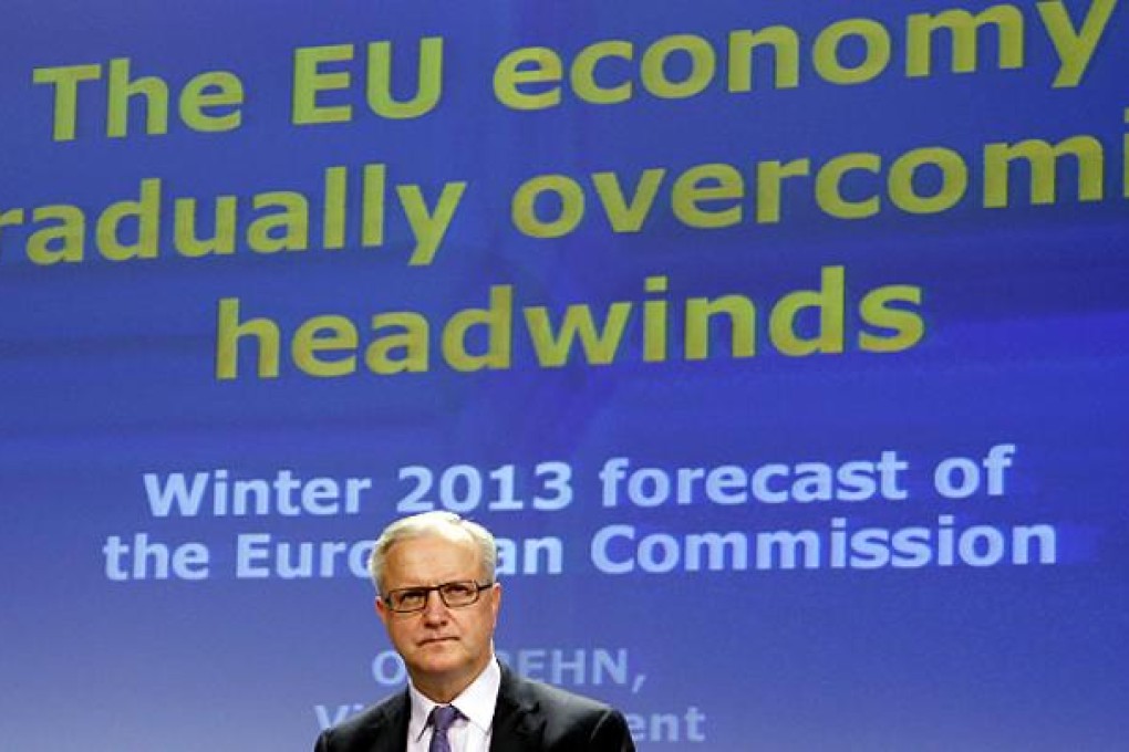 Economic Affairs Commissioner Olli Rehn presents the EU Commission's interim economic forecast in Brussels. Photo: Reuters