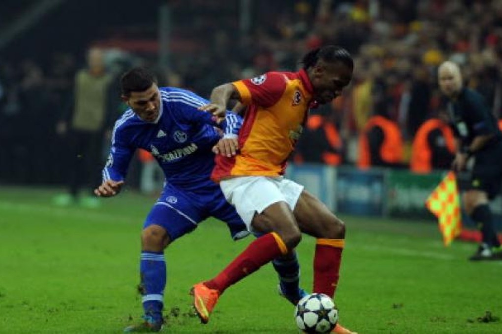 Didier Drogba (right) of Galatasaray vies with Sead Kolasinac of FC Schalke 04 during an Uefa Champions League match between Galatasaray and FC Schalke. Photo: Xinhua