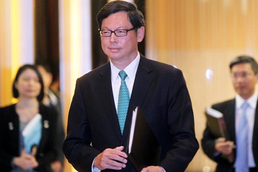 Monetary Authority chief Norman Chan Tak-lam briefs the press on new stamp duties. Photo: K. Y. Cheng