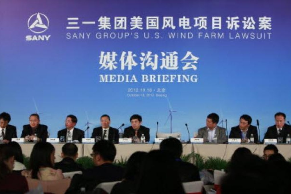 China's machinery maker Sany Group held a press conference on their plans to sue US President Barack Obama after he blocked Ralls Corp., an affiliate to Sany, from purchasing four wind farms in Northern Oregon. Photo: EPA