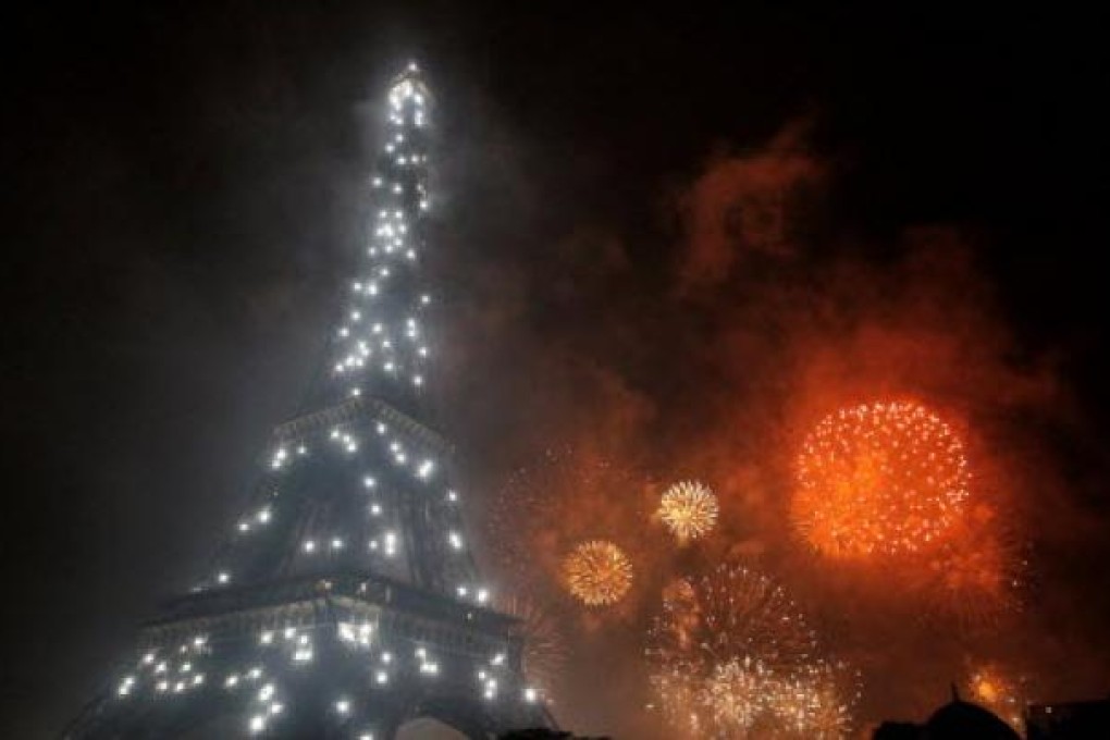 Fireworks burst over the Eiffel Tower in Paris. Photo: AFP