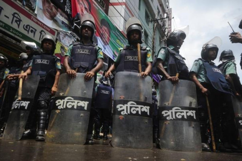 Part of a huge police cordon around the opposition headquarters. Photo: AFP
