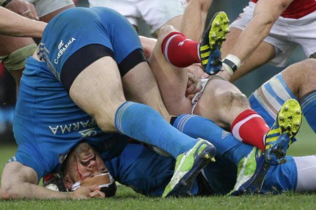 Italy's Andrea Masi battles for the ball during the Six Nations match against Wales at the Olympic stadium in Rome. Photo: Reuters