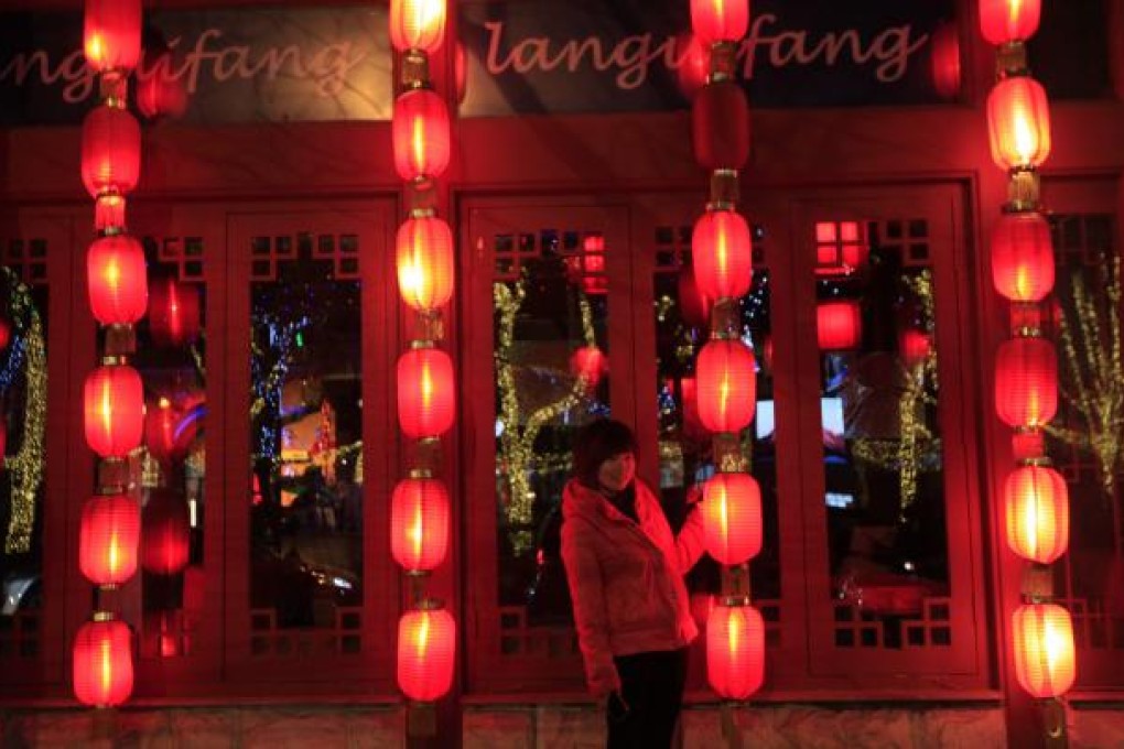 Lanterns are lit in Beijing to mark the official end to the Lunar New Year period. Photo: EPA