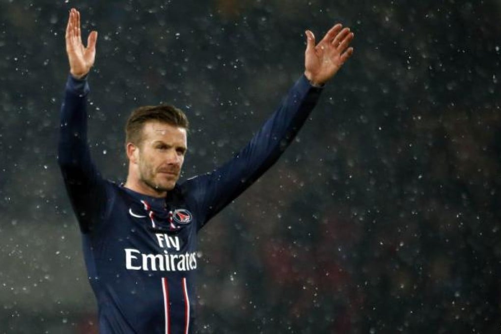 David Beckham takes in the adoration of the Paris Saint-Germain fans as he makes his debut for the club against Marseille. Photo: AFP