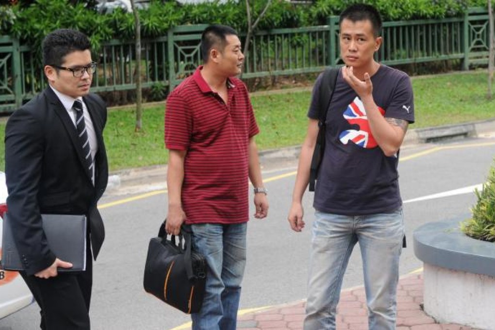 Liu Xiangying (left) and Gao Yue Qiang at court. Photo: AFP