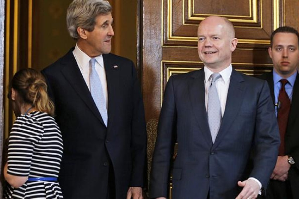 Britain's Foreign Secretary William Hague, right, meets US Secretary of State John Kerry for a news conference in central London. Photo: AP